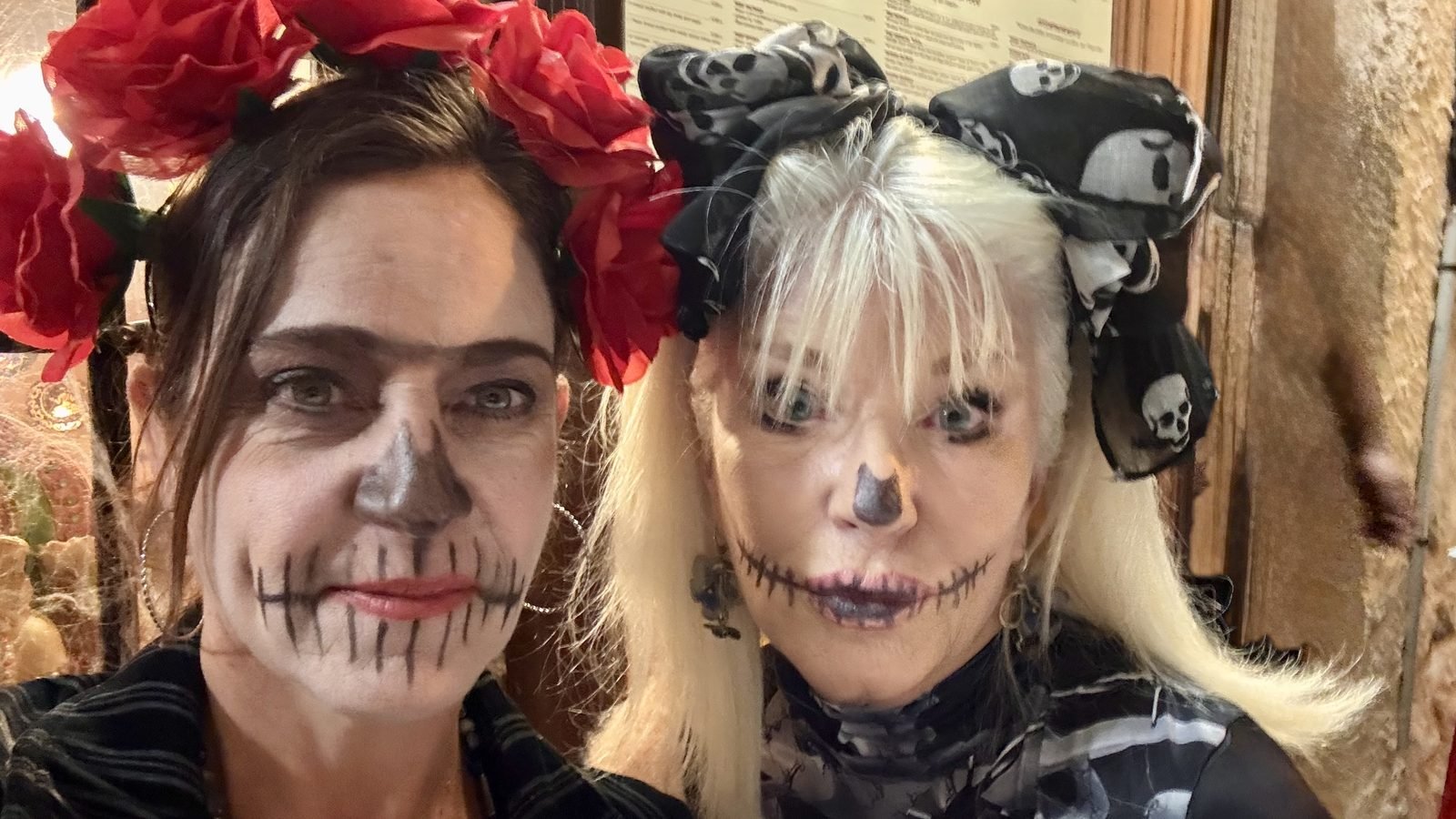 Halloween in Valbonne: two friends in costumes and skeleton make-up.